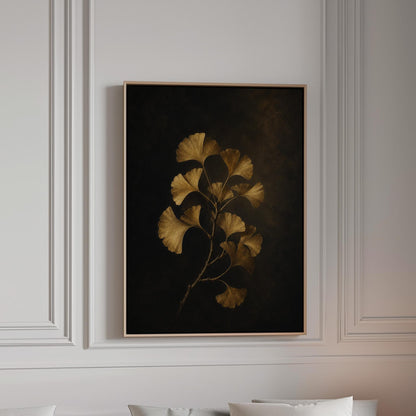 Golden ginkgo branch on a deep charcoal ground, canvas print in a bright room with natural daylight