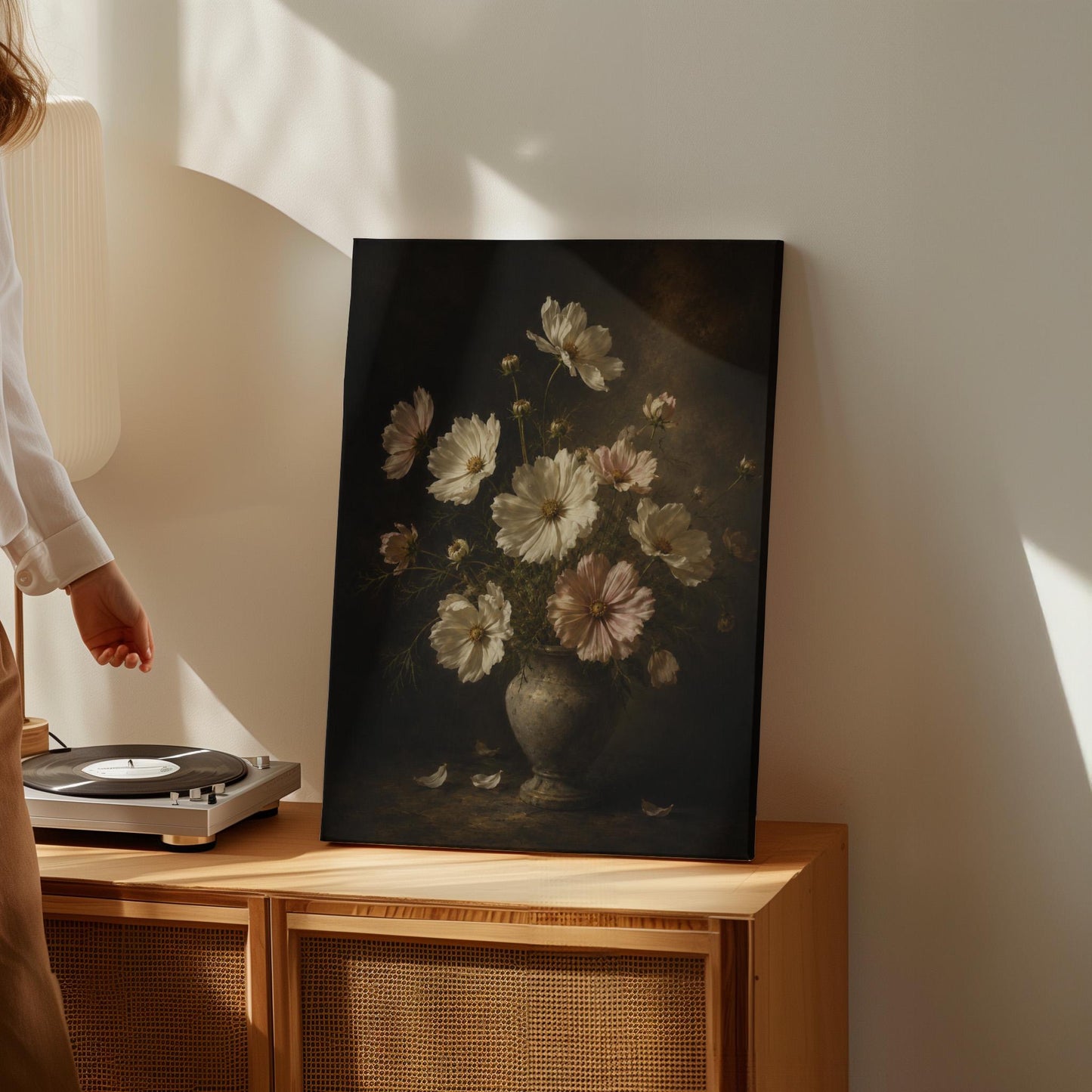 White cosmos flowers in a weathered stone vase, canvas print shown to scale in a furnished room