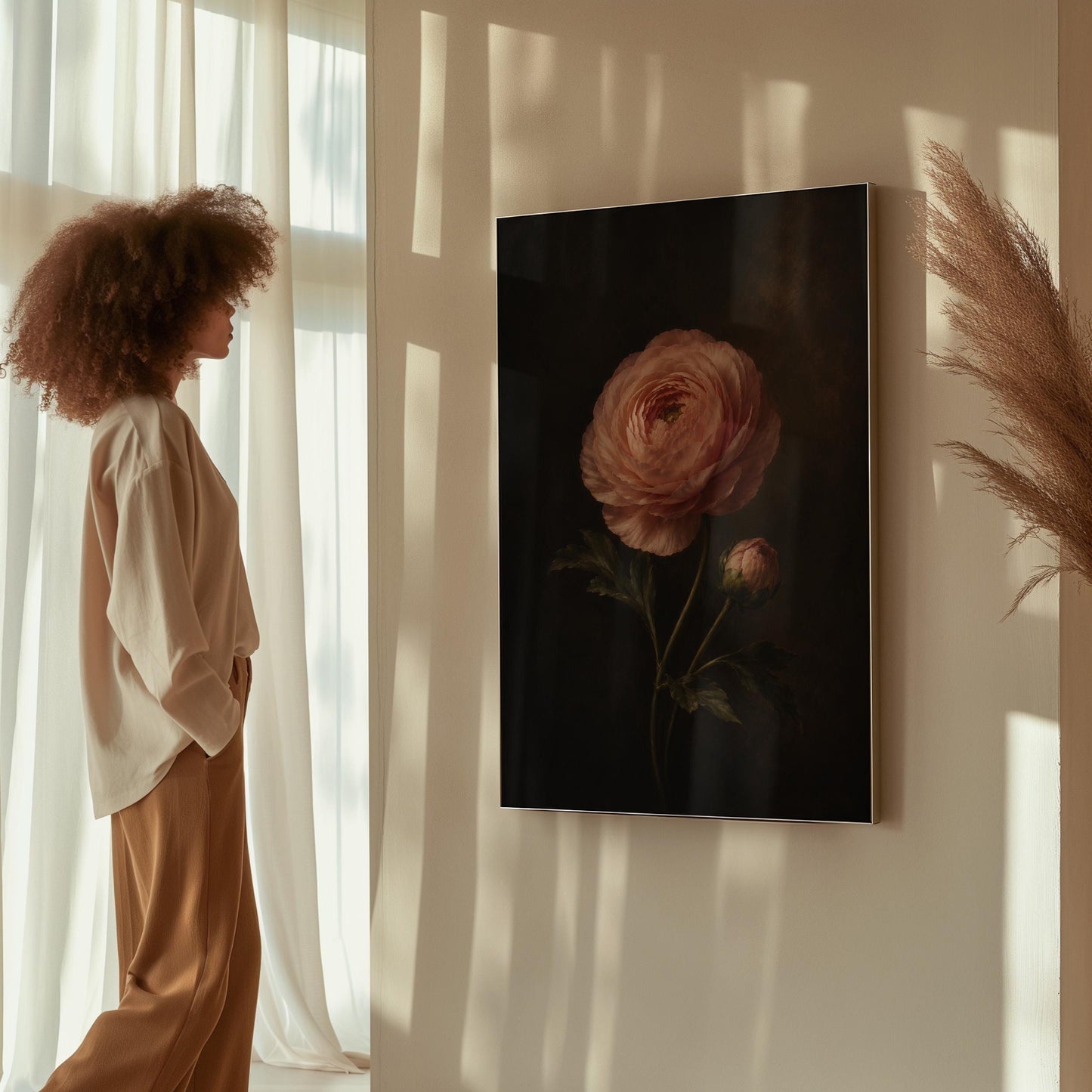 Single pink ranunculus bloom against dark shadow, canvas print presented in a light, minimal room