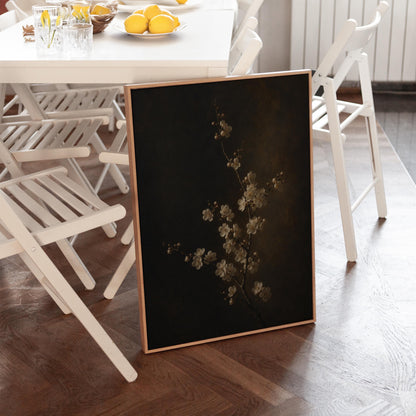 White blossom branch on a dark bronze ground, canvas print styled against a soft white wall