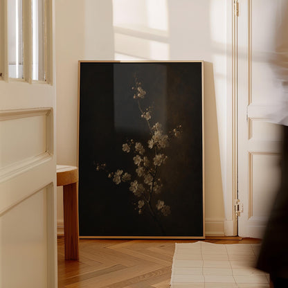 White blossom branch on a dark bronze ground, canvas wall art seen in a warm interior with natural light
