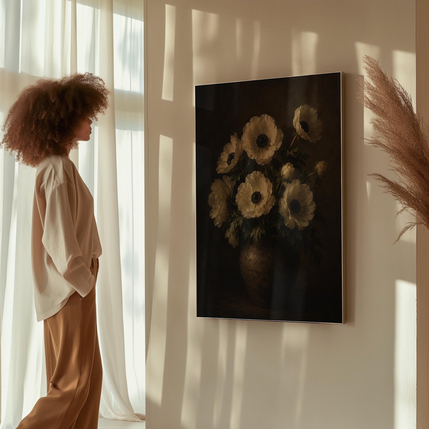White anemones with dark centres in an earthen vase, canvas wall art presented in a light, minimal room