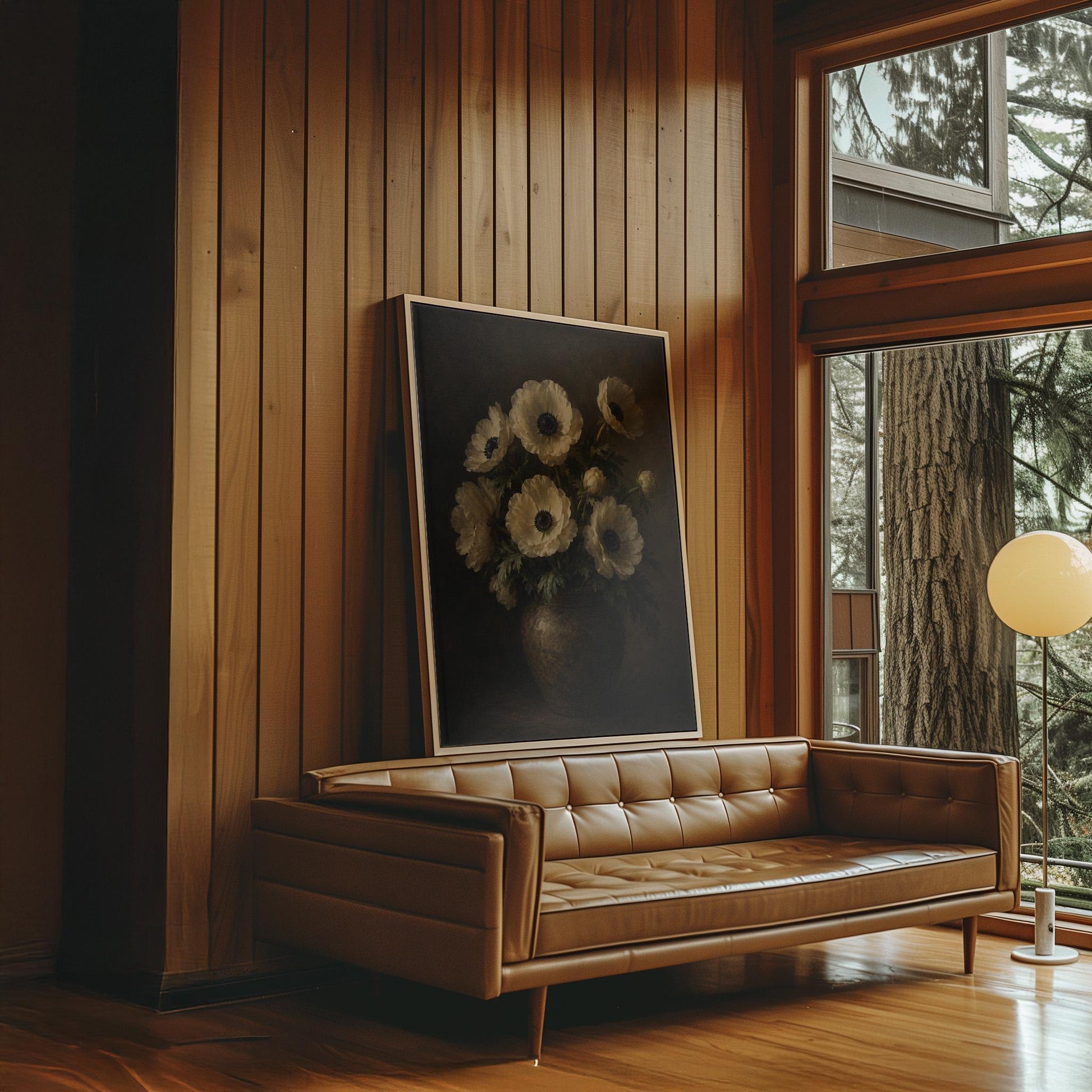 White anemones with dark centres in an earthen vase, canvas wall art on a quiet wall in a considered interior