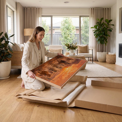 Herd of wild horses running through a desert at sunset, canvas print seen in a warm interior with natural light