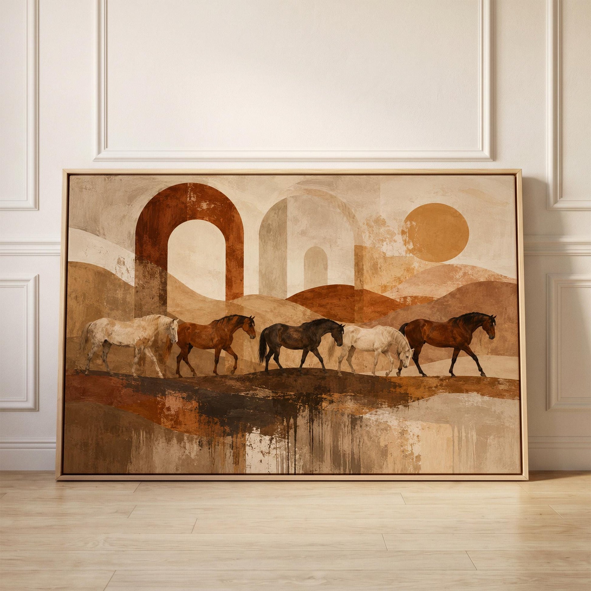 Horses walking across abstract terracotta desert bands, canvas print held up against a sunlit bedroom wall