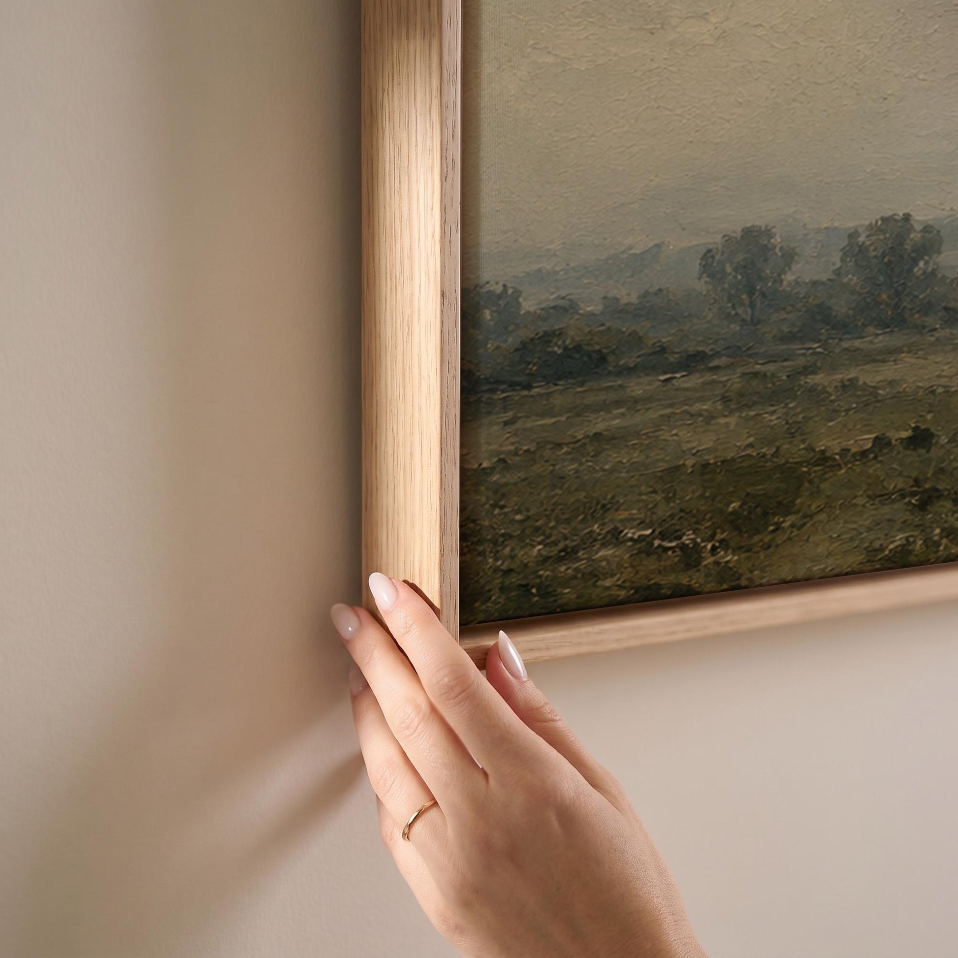 Dapple grey horse looking out over a hazy green valley, canvas print shown at full size in a light-filled bedroom