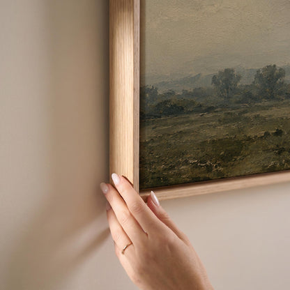 Dapple grey horse looking out over a hazy green valley, canvas print shown at full size in a light-filled bedroom