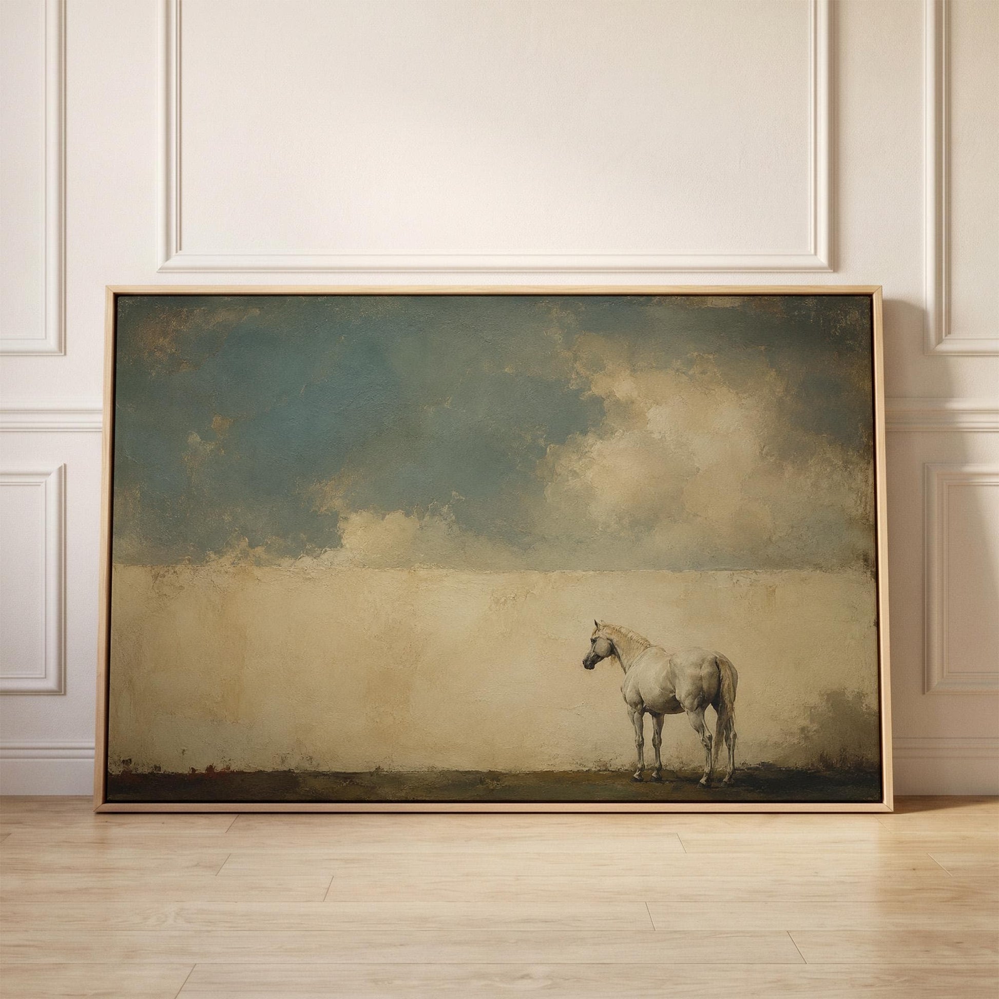 Pale horse alone in a minimalist blue and beige landscape, canvas print held up against a sunlit bedroom wall