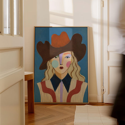Blonde cowgirl in a rust cowboy hat with a cubist face on deep blue, canvas print hanging in a calm, modern living space