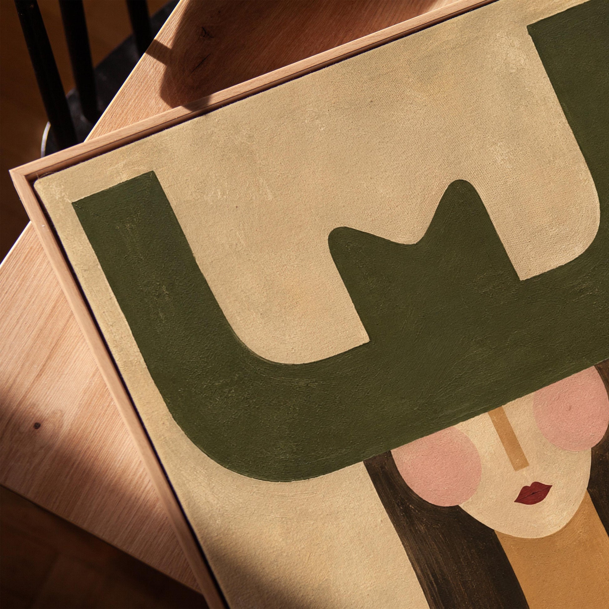 Minimal cowgirl with a bold green hat and red-teal striped shirt on cream, canvas print in a warm, minimally styled interior