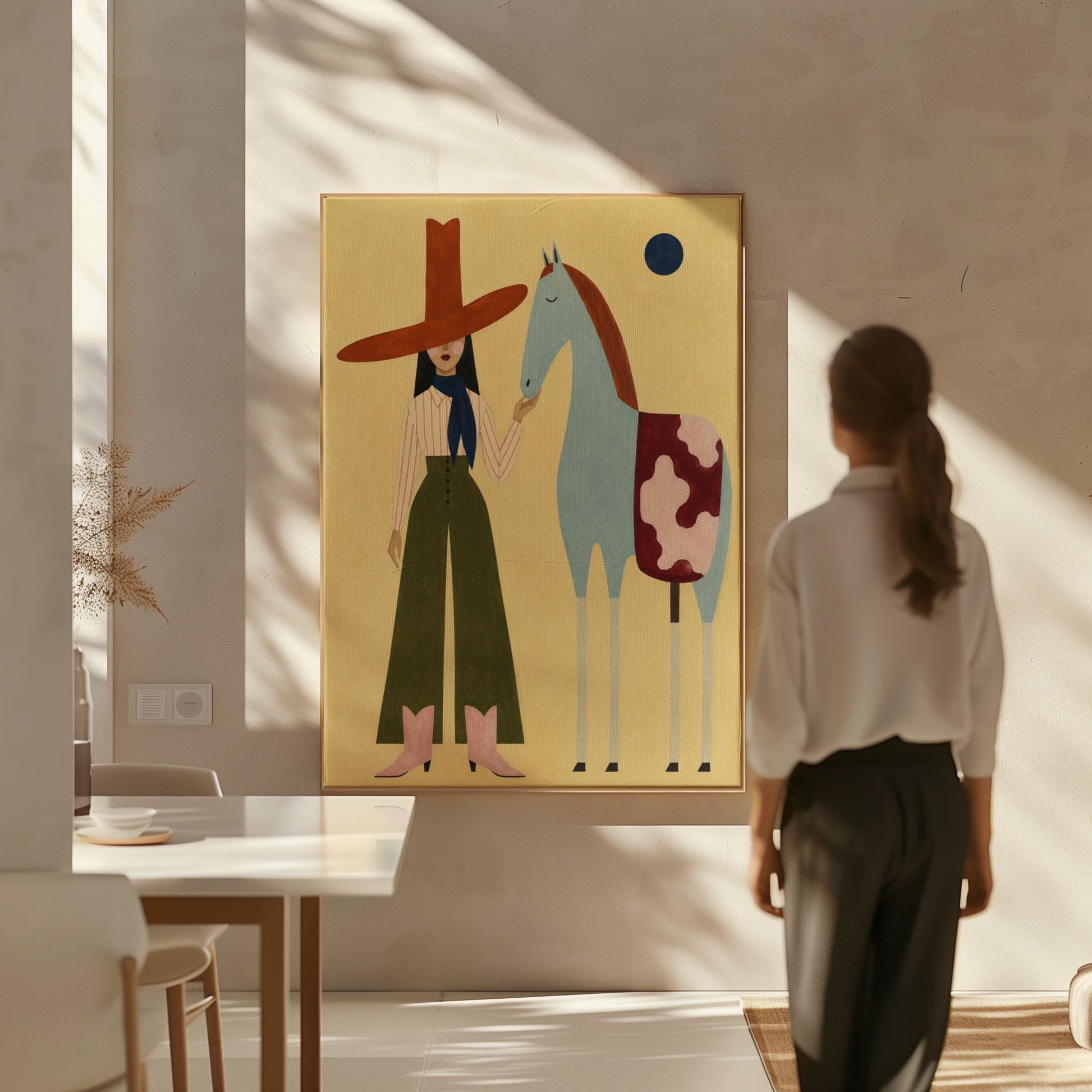 Cowgirl in a red hat standing beside a pale blue spotted horse on warm yellow, canvas print shown in a sunlit, contemporary room