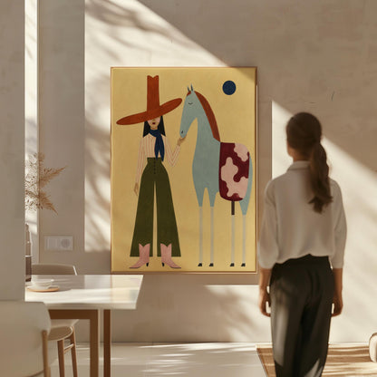 Cowgirl in a red hat standing beside a pale blue spotted horse on warm yellow, canvas print shown in a sunlit, contemporary room