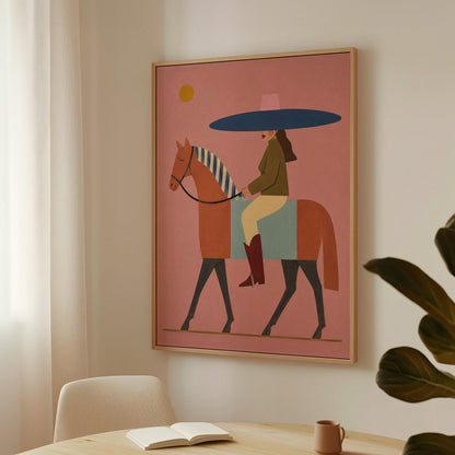 Woman in a wide navy hat riding a chestnut horse in profile on coral pink, canvas print shown in a sunlit, contemporary room