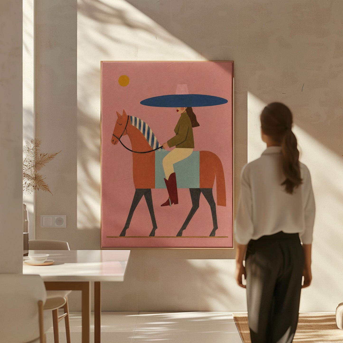 Woman in a wide navy hat riding a chestnut horse in profile on coral pink, canvas wall art on a quiet wall in a considered interior