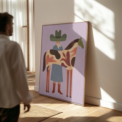 Cowgirl in a green hat beside a tall patterned horse on soft lilac, canvas wall art styled against a soft white wall