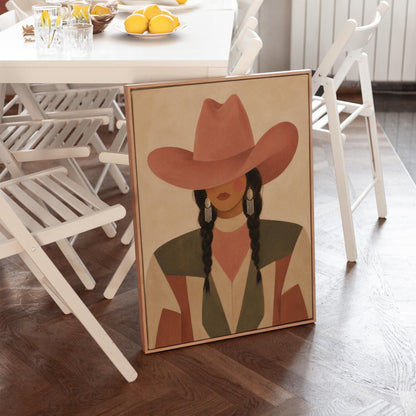 Cowgirl with dark braids under a wide terracotta hat and earthy western jacket, canvas wall art seen in a warm interior with natural light