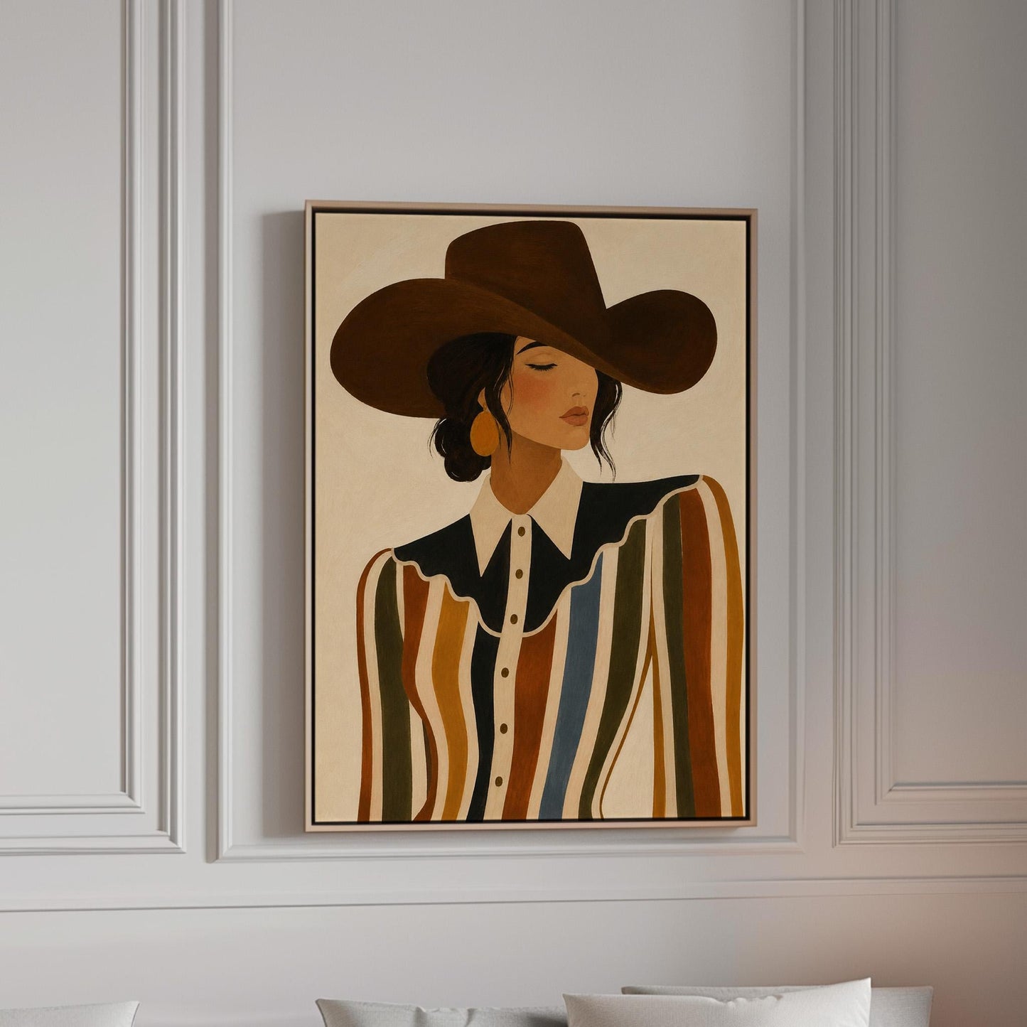 Cowgirl in a brown hat and rippling striped blouse with a black collar on cream, canvas print in a bright room with natural daylight