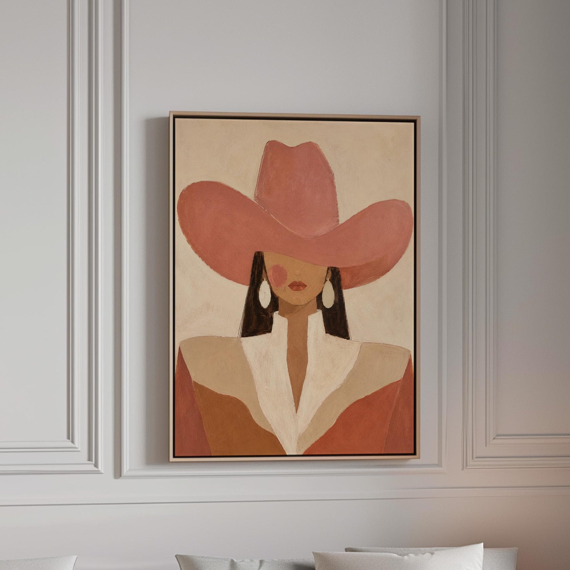 Minimal cowgirl in a coral hat and white collar with dark hair on cream, canvas print in a bright room with natural daylight
