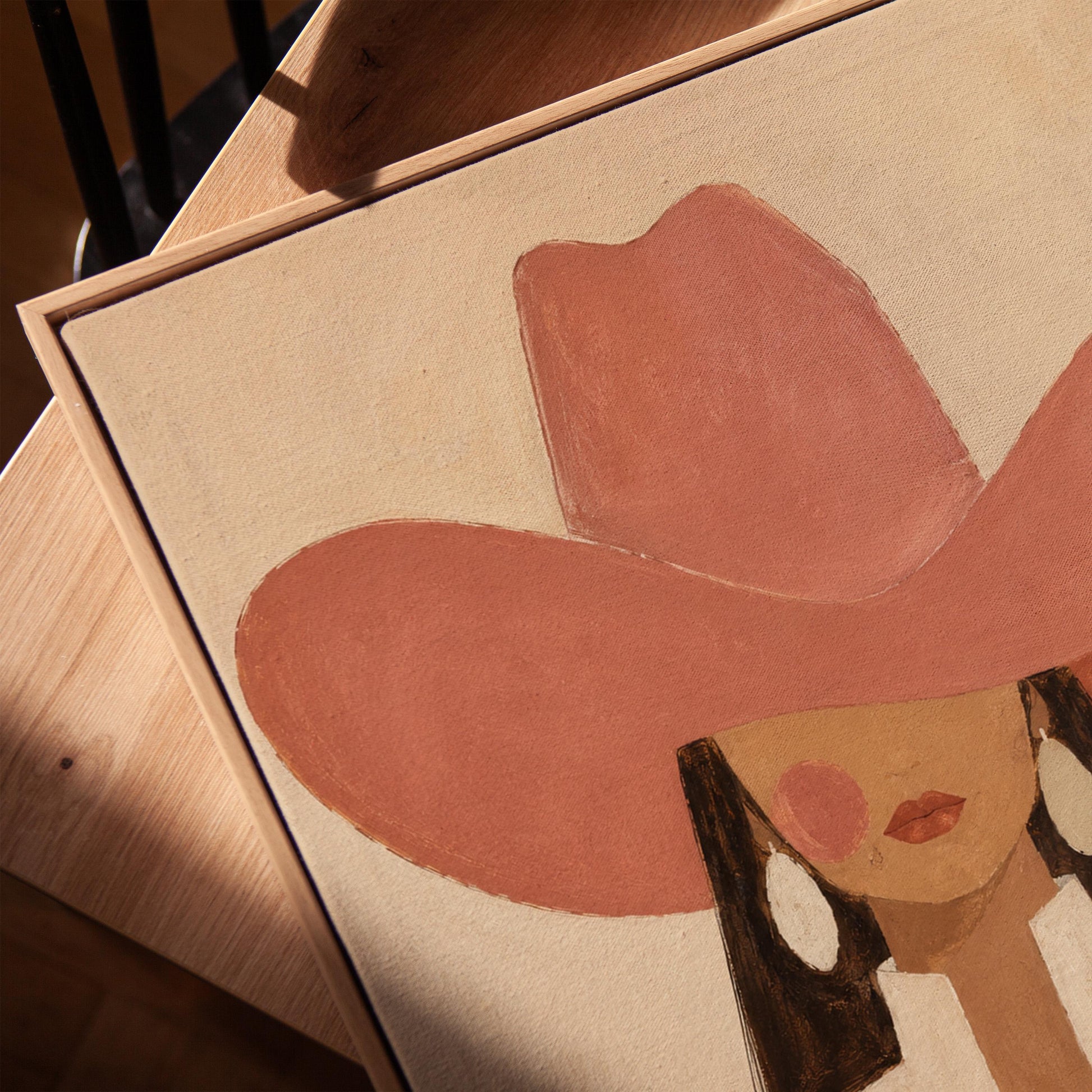 Minimal cowgirl in a coral hat and white collar with dark hair on cream, canvas print in a warm, minimally styled interior