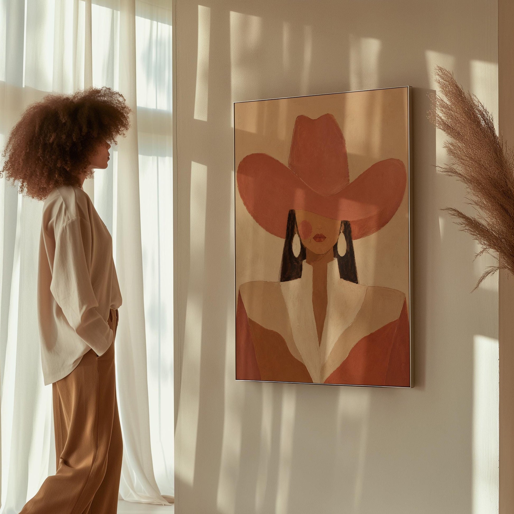 Minimal cowgirl in a coral hat and white collar with dark hair on cream, canvas print on a quiet wall in a considered interior