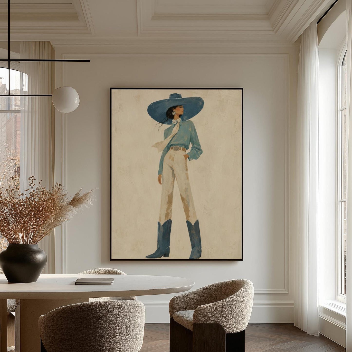 Full-figure cowgirl in a wide teal hat, blouse and boots with cream trousers, canvas print hanging in a calm, modern living space