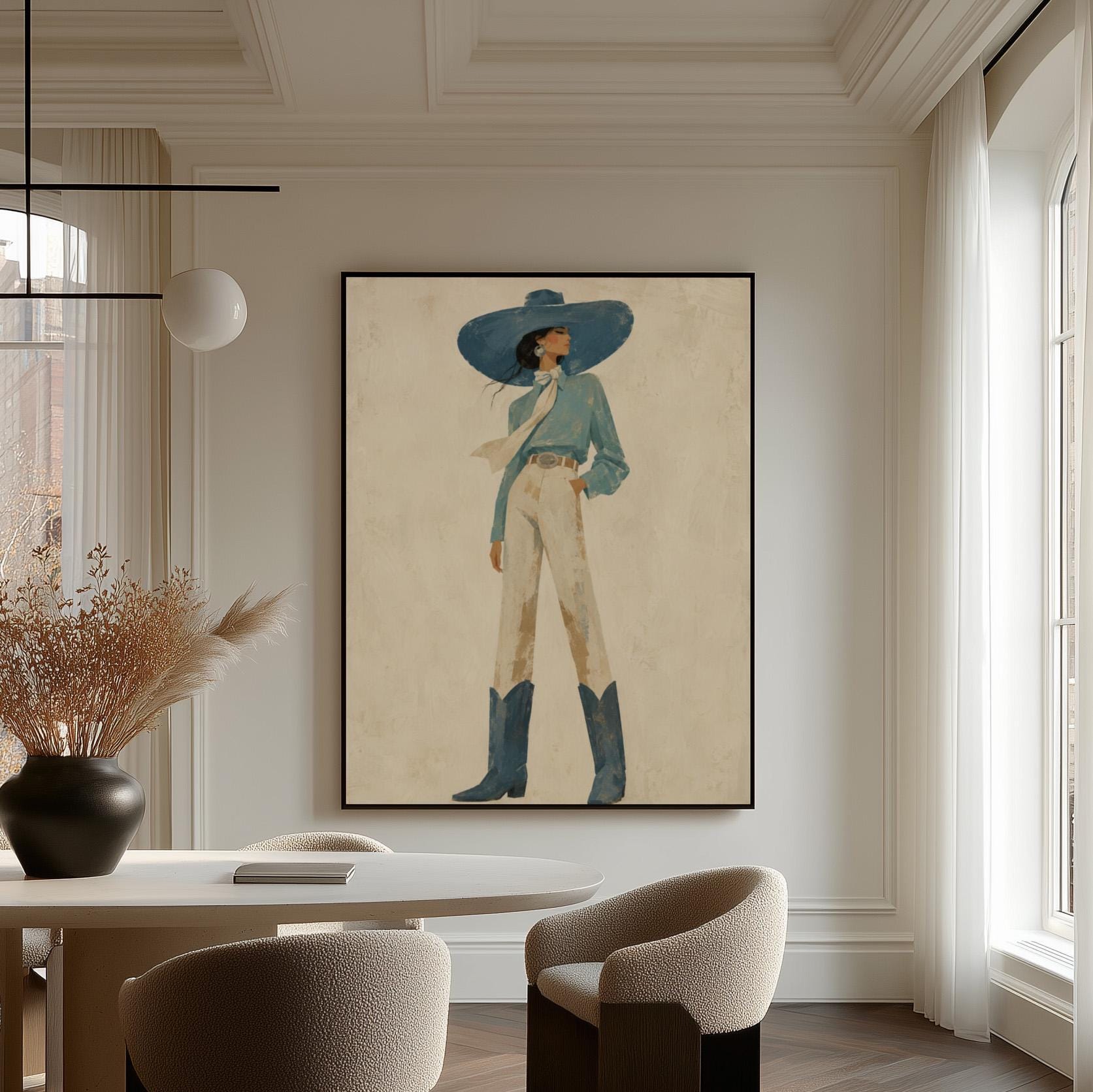 Full-figure cowgirl in a wide teal hat, blouse and boots with cream trousers, canvas print hanging in a calm, modern living space