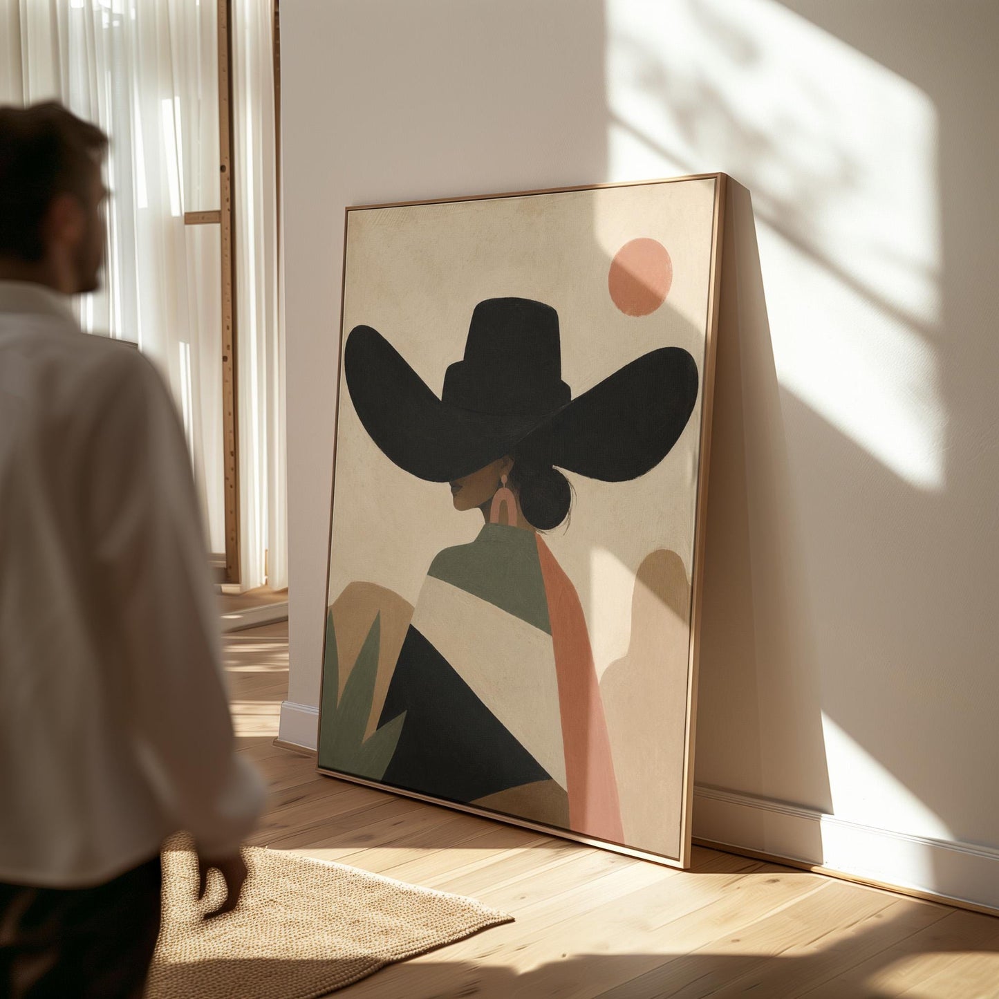 Cowgirl seen from behind in a large black hat and serape under a desert sun, canvas wall art on a quiet wall in a considered interior