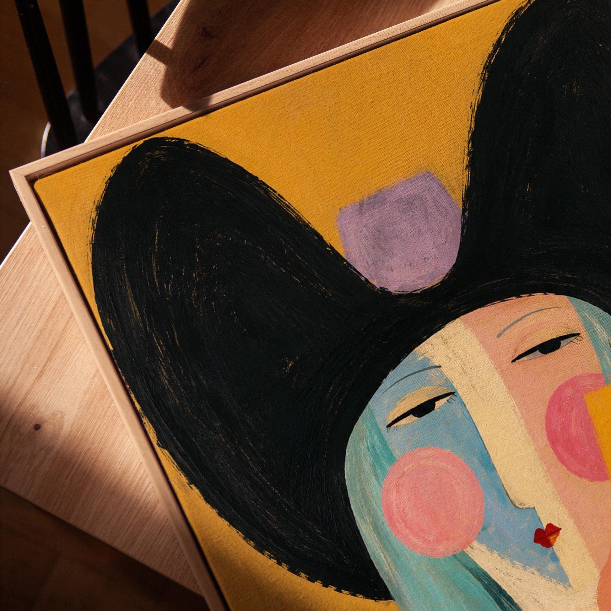 Expressive cowgirl with sweeping black hair and a scarf on an ochre ground, canvas print in a warm, minimally styled interior
