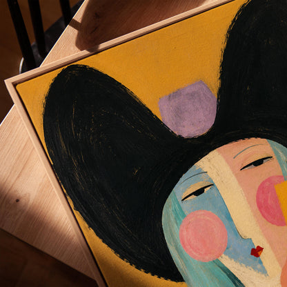 Expressive cowgirl with sweeping black hair and a scarf on an ochre ground, canvas print in a warm, minimally styled interior