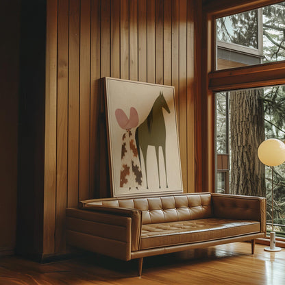 Cowgirl in a green hat and spotted pants before a deep maroon folk horse, canvas print seen in a warm interior with natural light