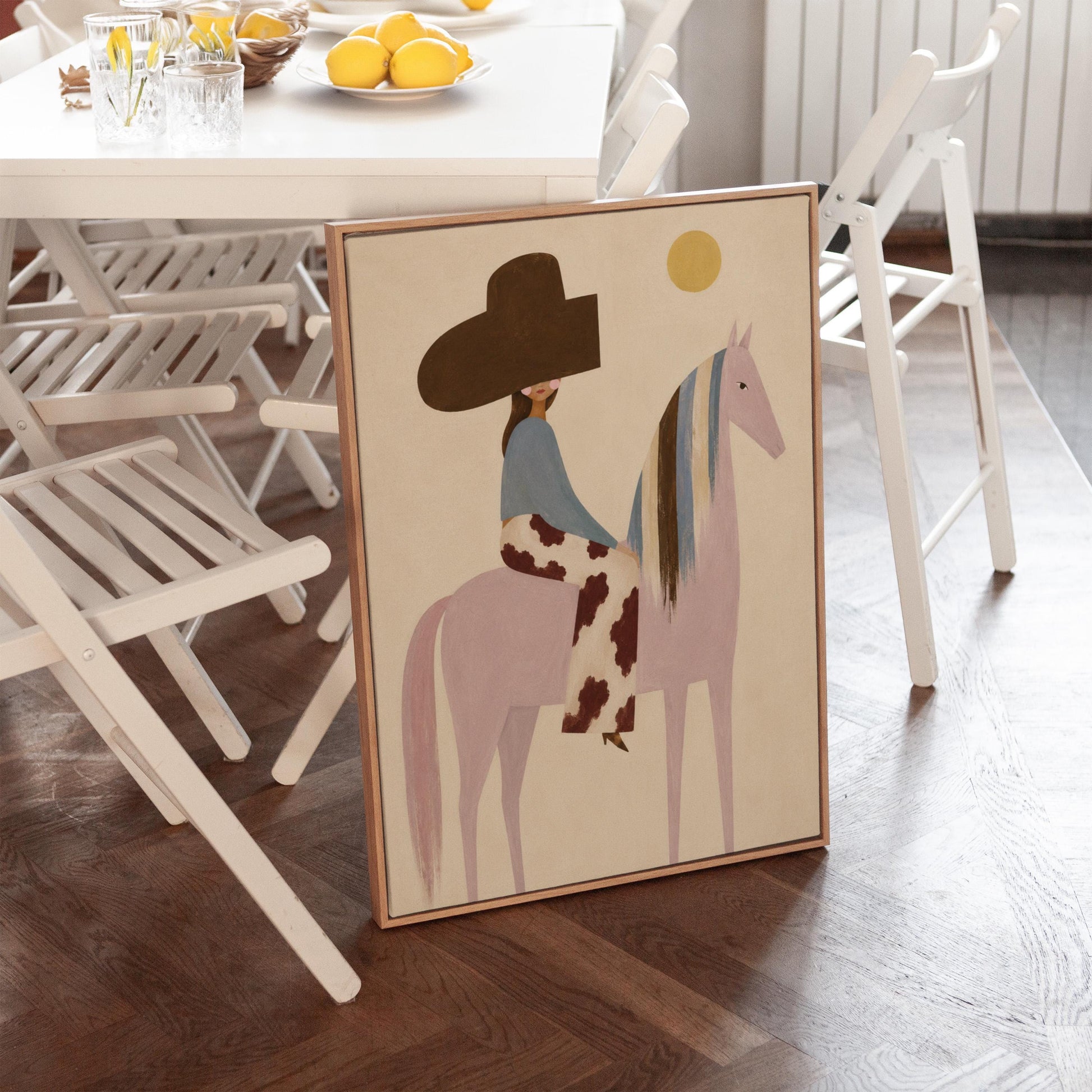 Woman in a large brown hat riding a soft pink horse with a striped mane, canvas print styled against a soft white wall