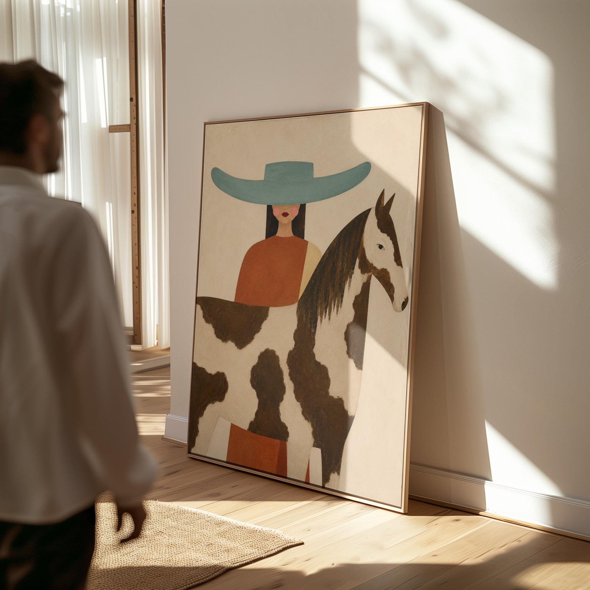Woman in a teal hat beside a brown and white pinto horse in warm light, canvas wall art seen in a warm interior with natural light