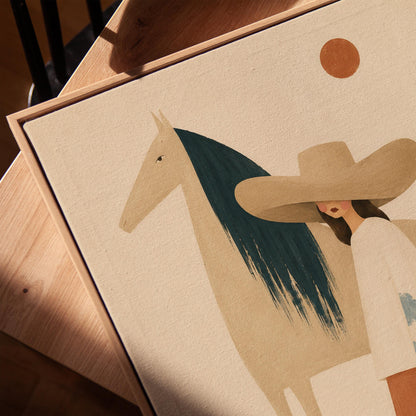 Woman in a broad tan hat beside a cream horse with a teal mane at sunset, canvas print in a warm, minimally styled interior