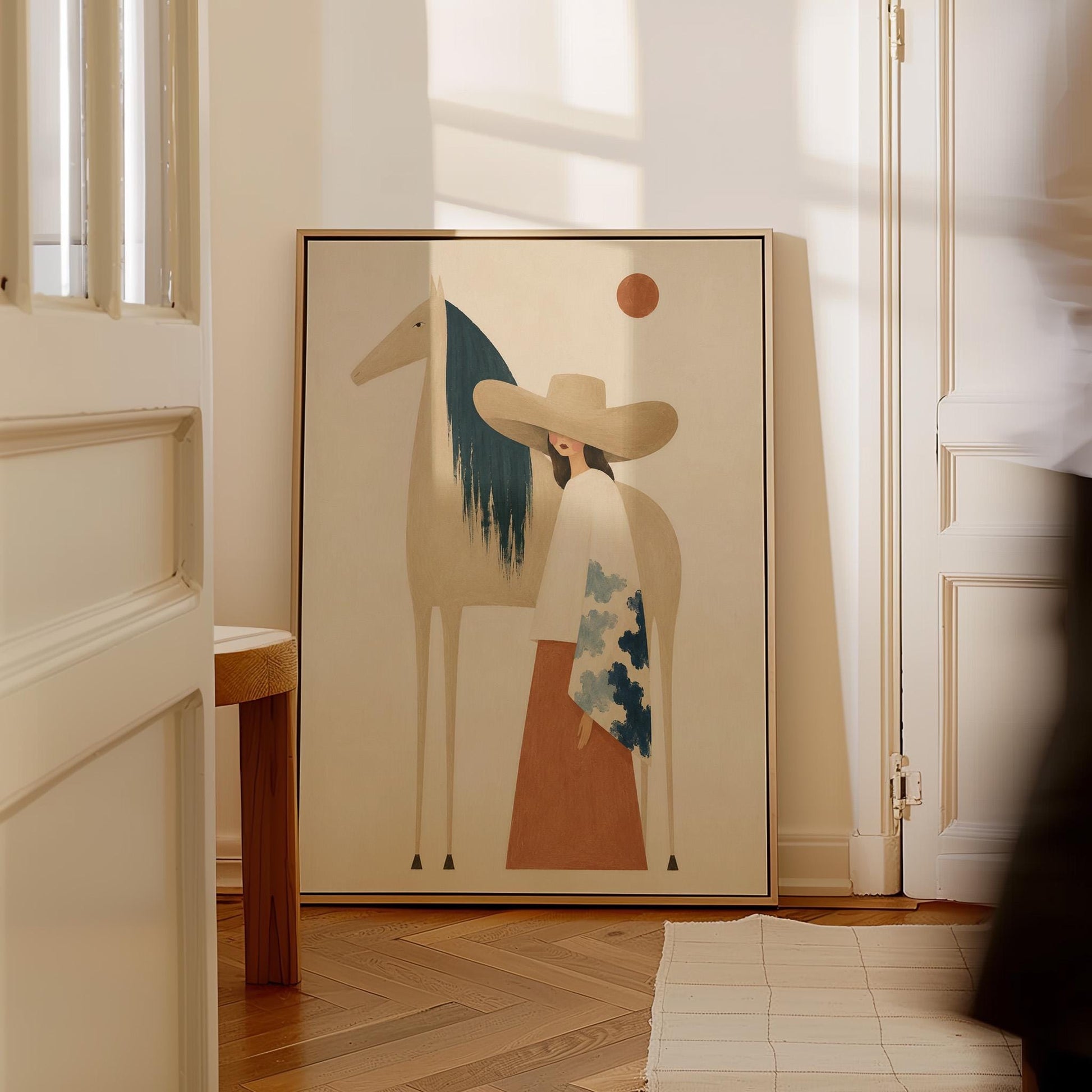 Woman in a broad tan hat beside a cream horse with a teal mane at sunset, canvas print seen in a warm interior with natural light
