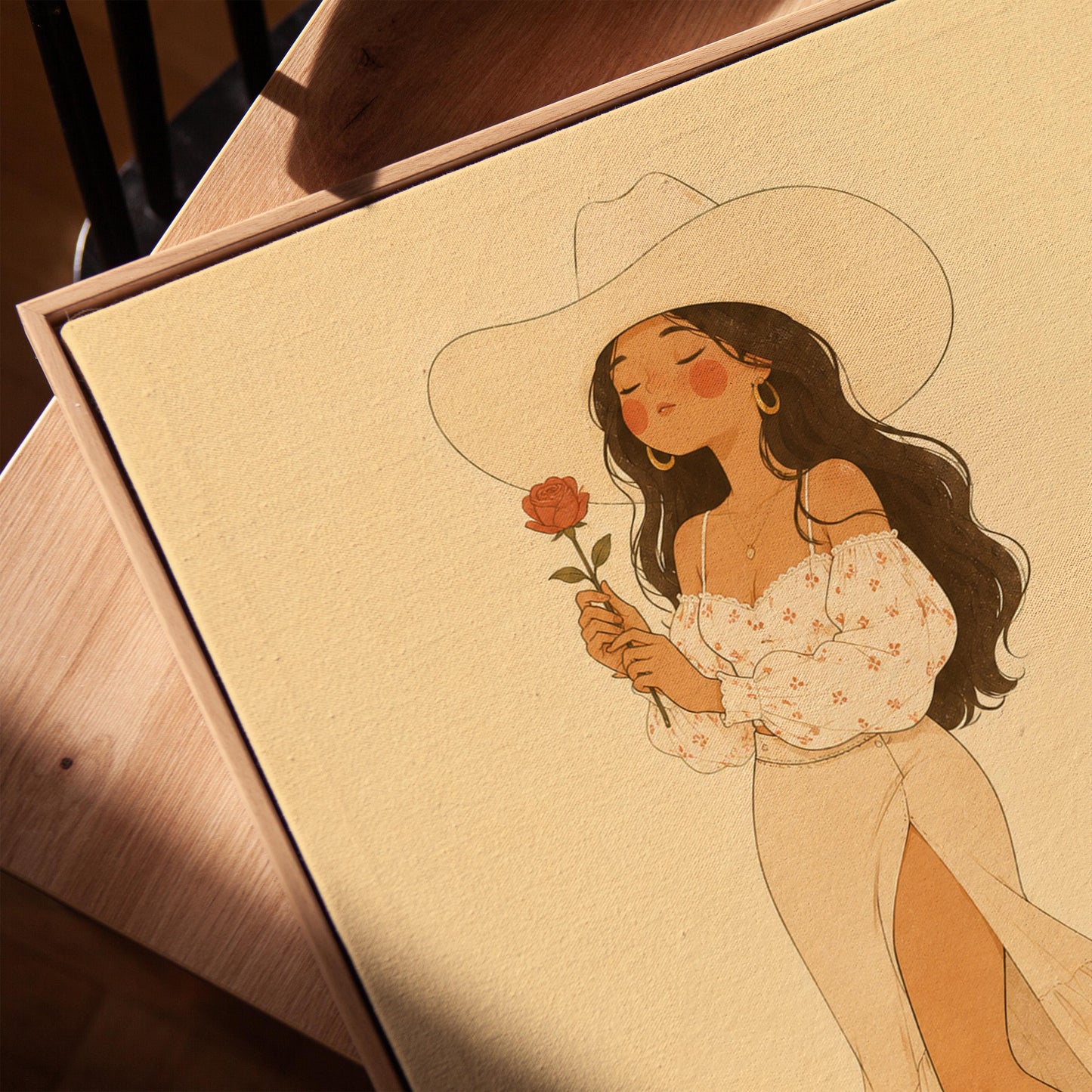 Cowgirl in white dress holding a red rose under a wide hat, canvas print in a warm, minimally styled interior