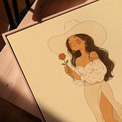 Cowgirl in white dress holding a red rose under a wide hat, canvas print in a warm, minimally styled interior