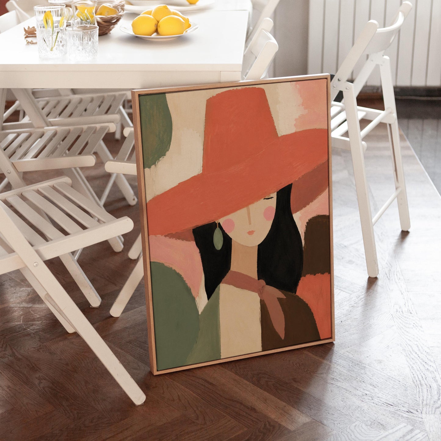 Woman in a wide coral hat with jade earring on blocked color, canvas wall art hanging in a calm, modern living space