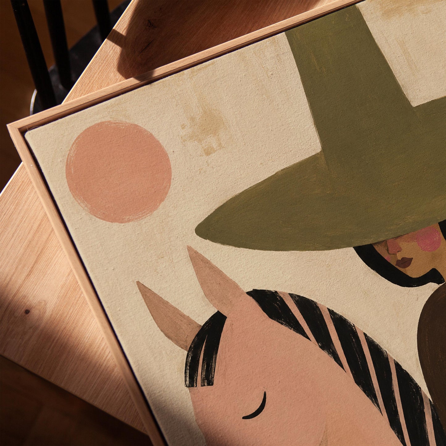 Pink horse beside a cowgirl in an olive hat with leaf motifs, canvas print in a warm, minimally styled interior