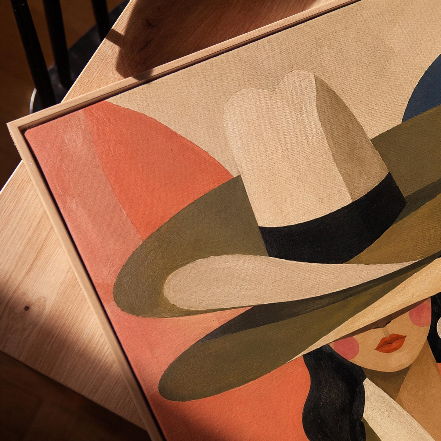 Cowgirl in a tall cream hat and spotted coat on coral and navy, canvas print in a warm, minimally styled interior