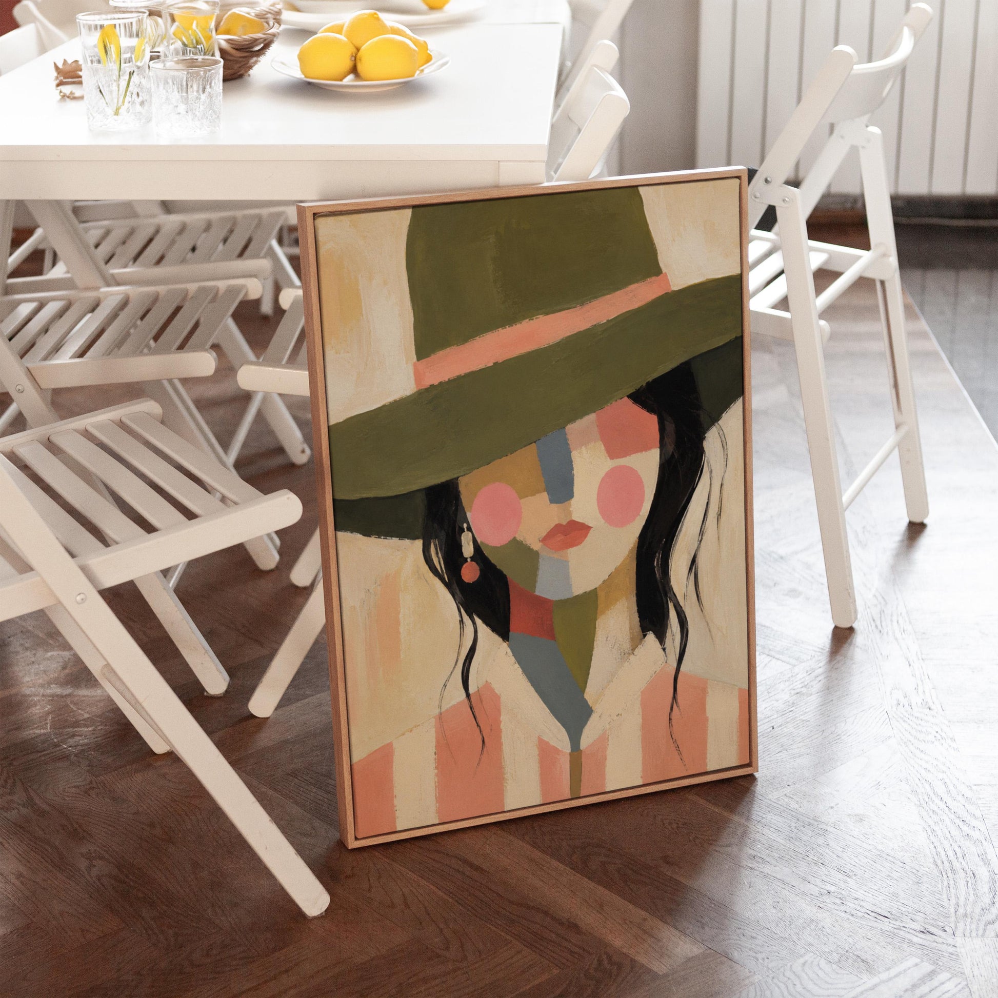 Cowgirl in olive hat with a patchwork face of soft color blocks, canvas print on a quiet wall in a considered interior