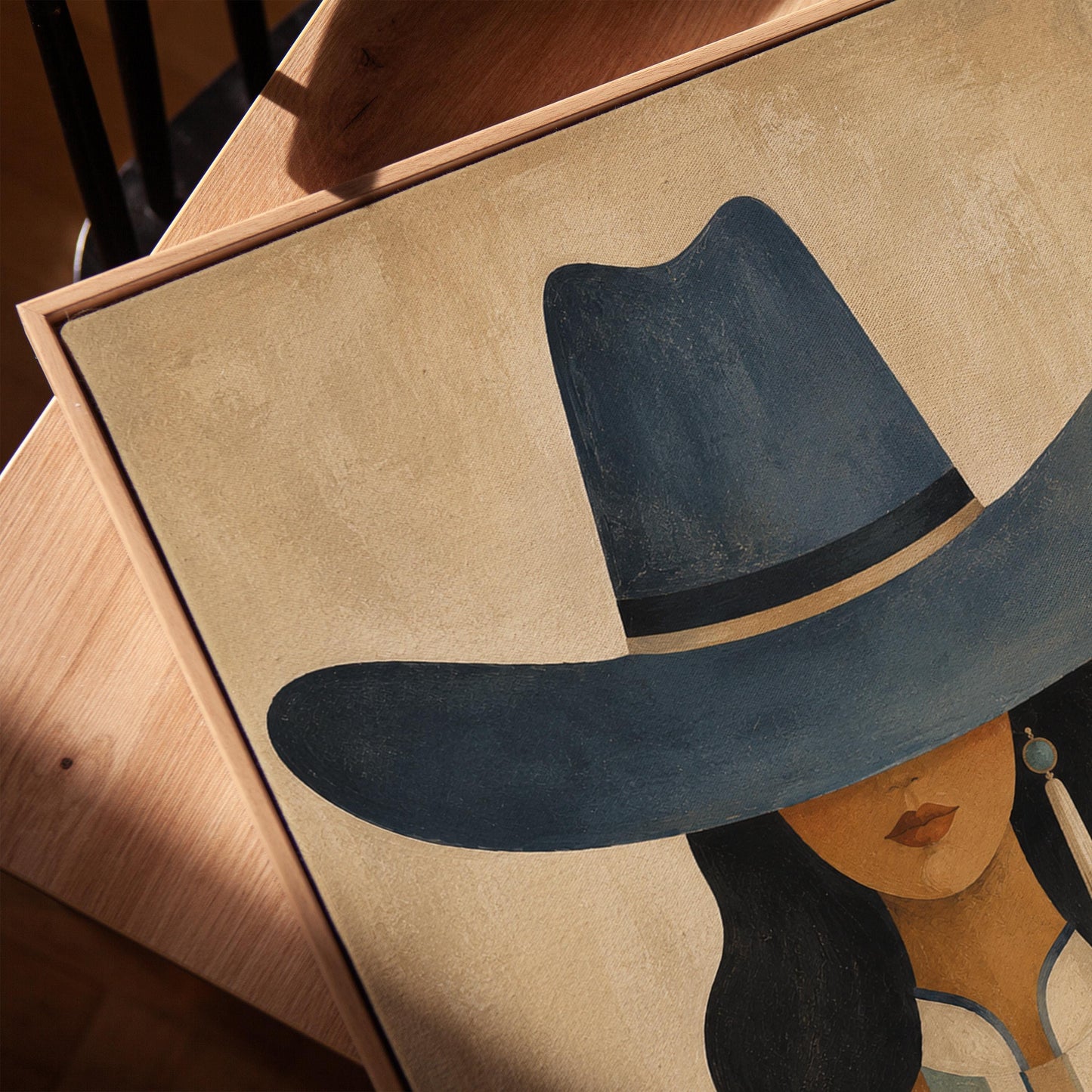 Cowgirl in a slate blue hat and striped shirt on warm sand, canvas print in a warm, minimally styled interior