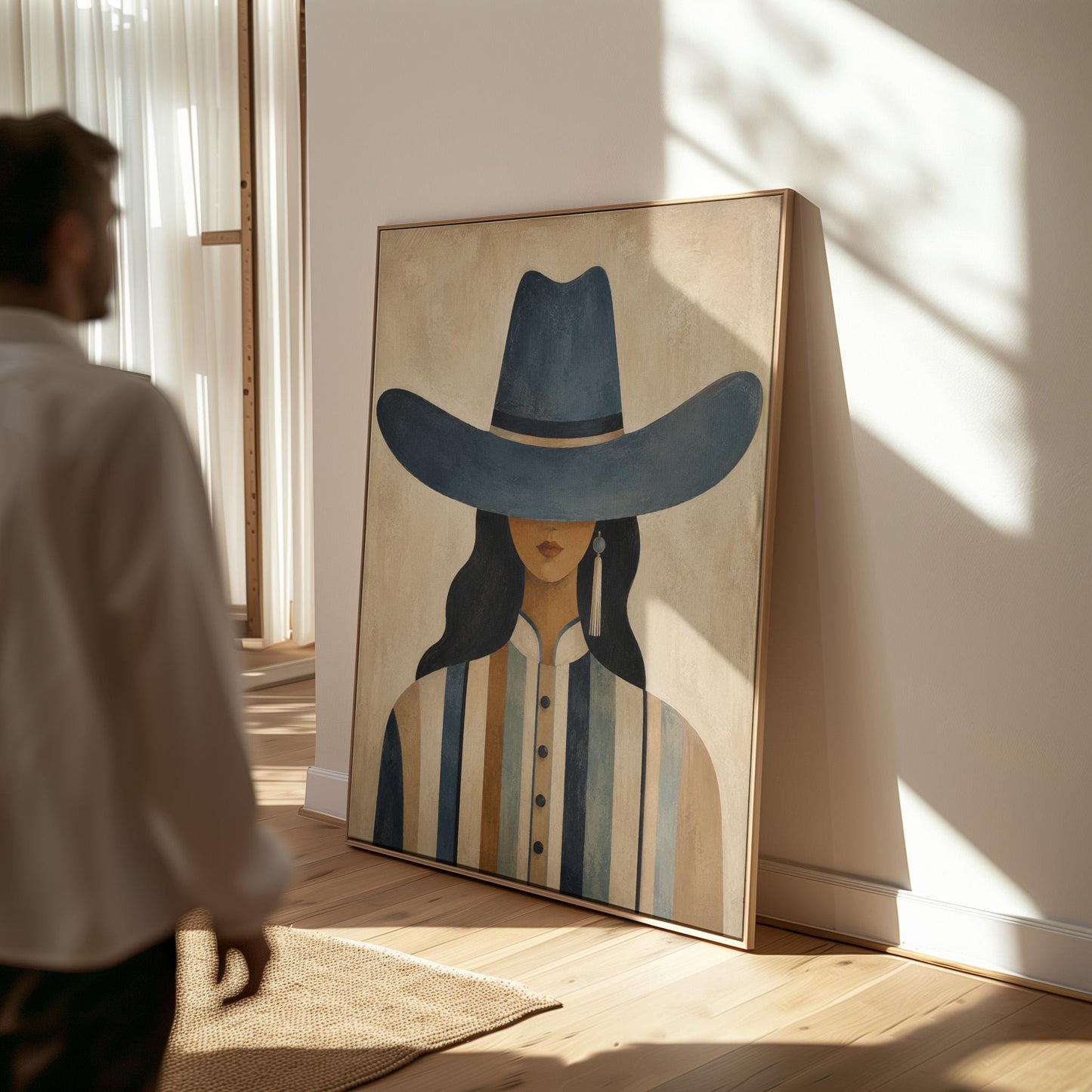 Cowgirl in a slate blue hat and striped shirt on warm sand, canvas print shown in a sunlit, contemporary room