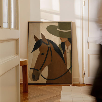 Bay horse in a bridle with a cowgirl in an olive hat behind, canvas wall art styled against a soft white wall
