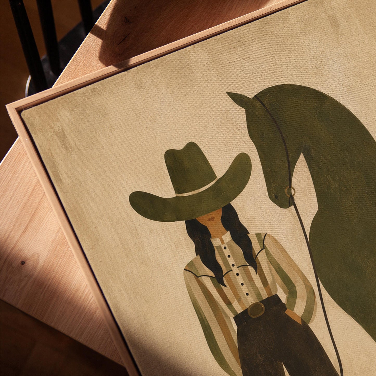Cowgirl in wide trousers leading a flat olive green horse, canvas print in a warm, minimally styled interior