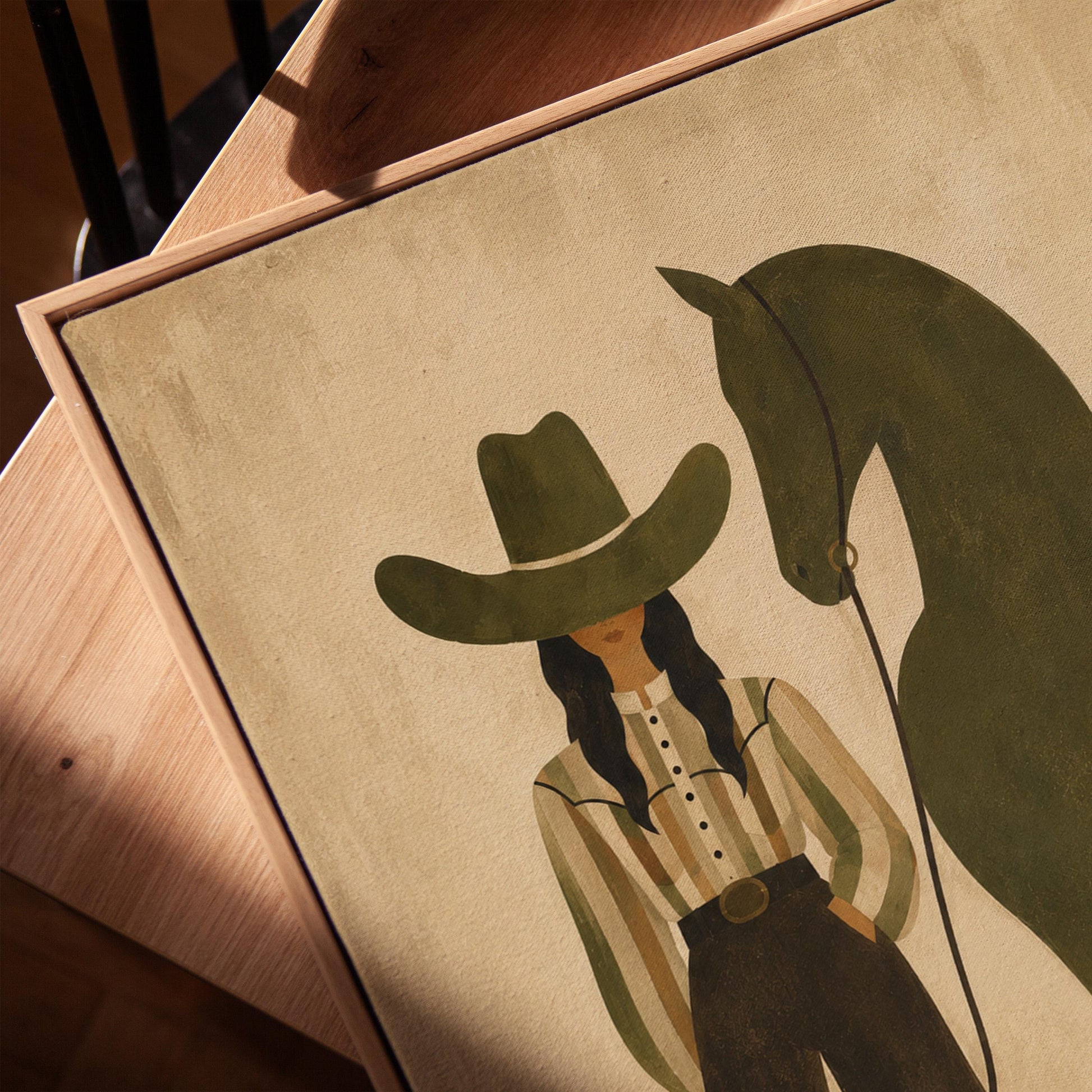 Cowgirl in wide trousers leading a flat olive green horse, canvas print in a warm, minimally styled interior
