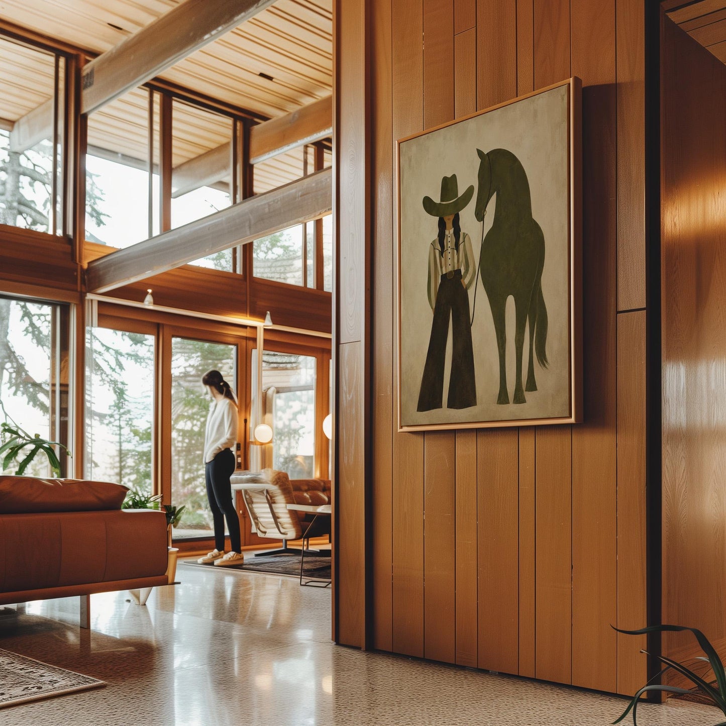 Cowgirl in wide trousers leading a flat olive green horse, canvas wall art seen in a warm interior with natural light