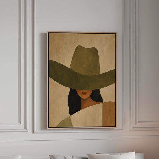 Cropped cowgirl face beneath the sweeping brim of a large olive hat, canvas print in a bright room with natural daylight