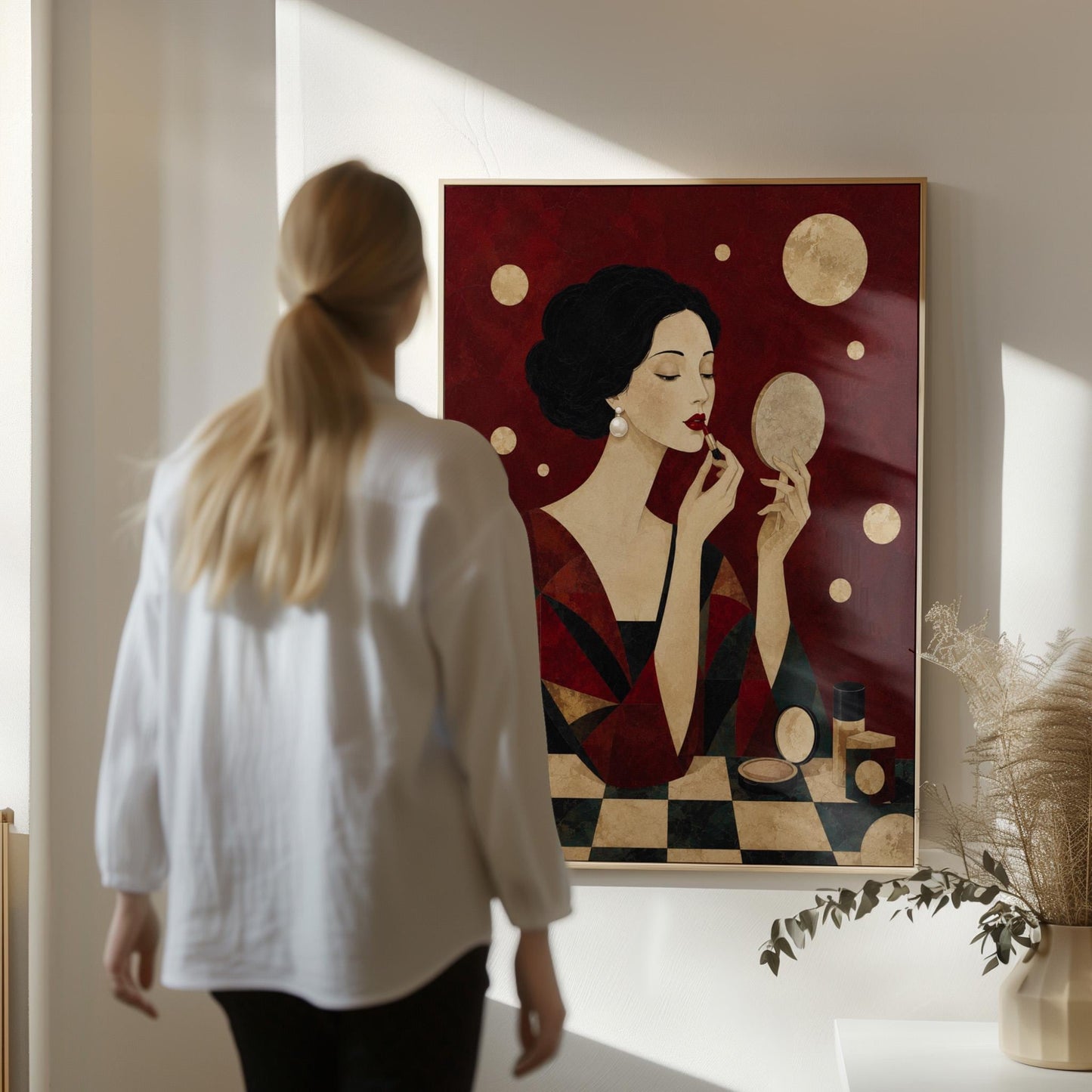 Woman applying red lipstick while holding a hand mirror, canvas print seen in a warm interior with natural light