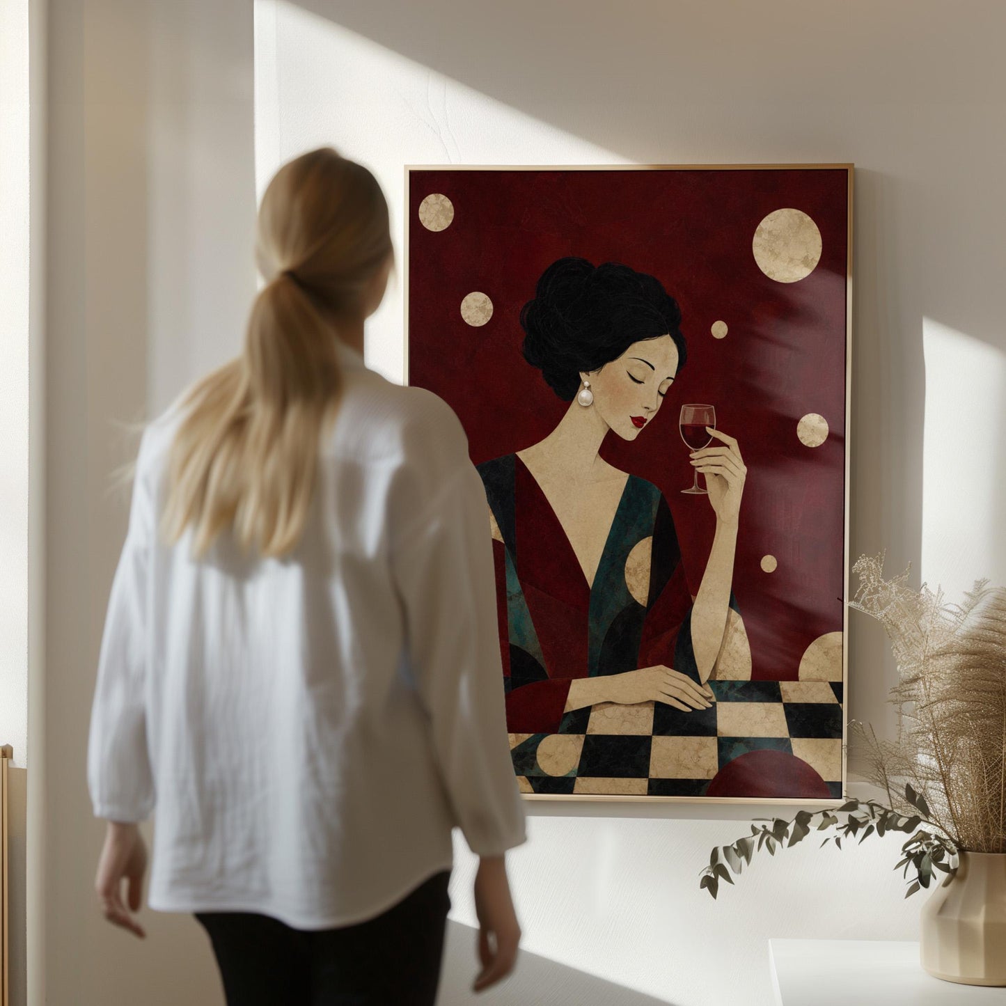 Woman with closed eyes lifting a glass of red wine at a dark table, canvas wall art presented in a light, minimal room