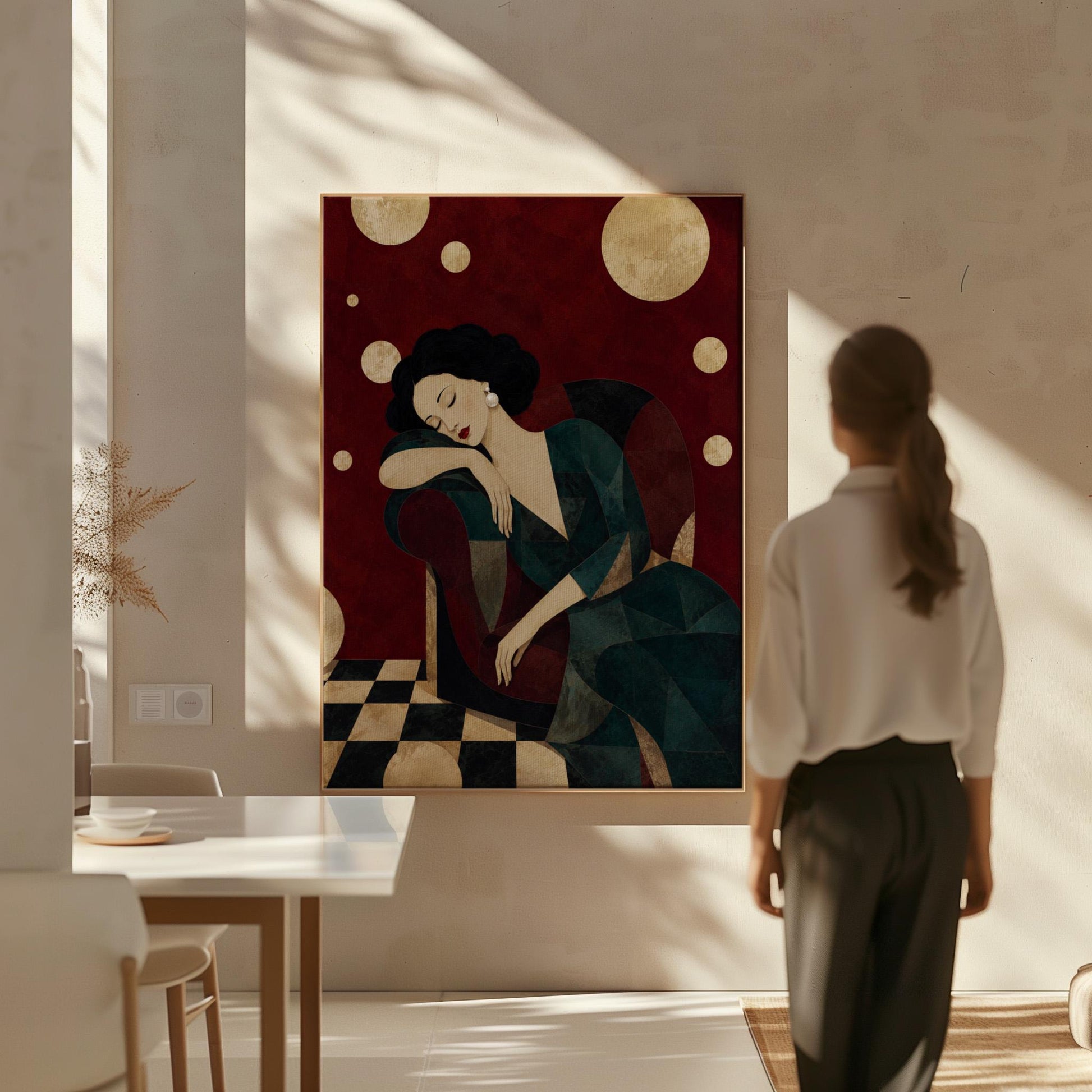Dark haired woman asleep draped over the back of a deep red armchair, canvas print shown to scale in a furnished room